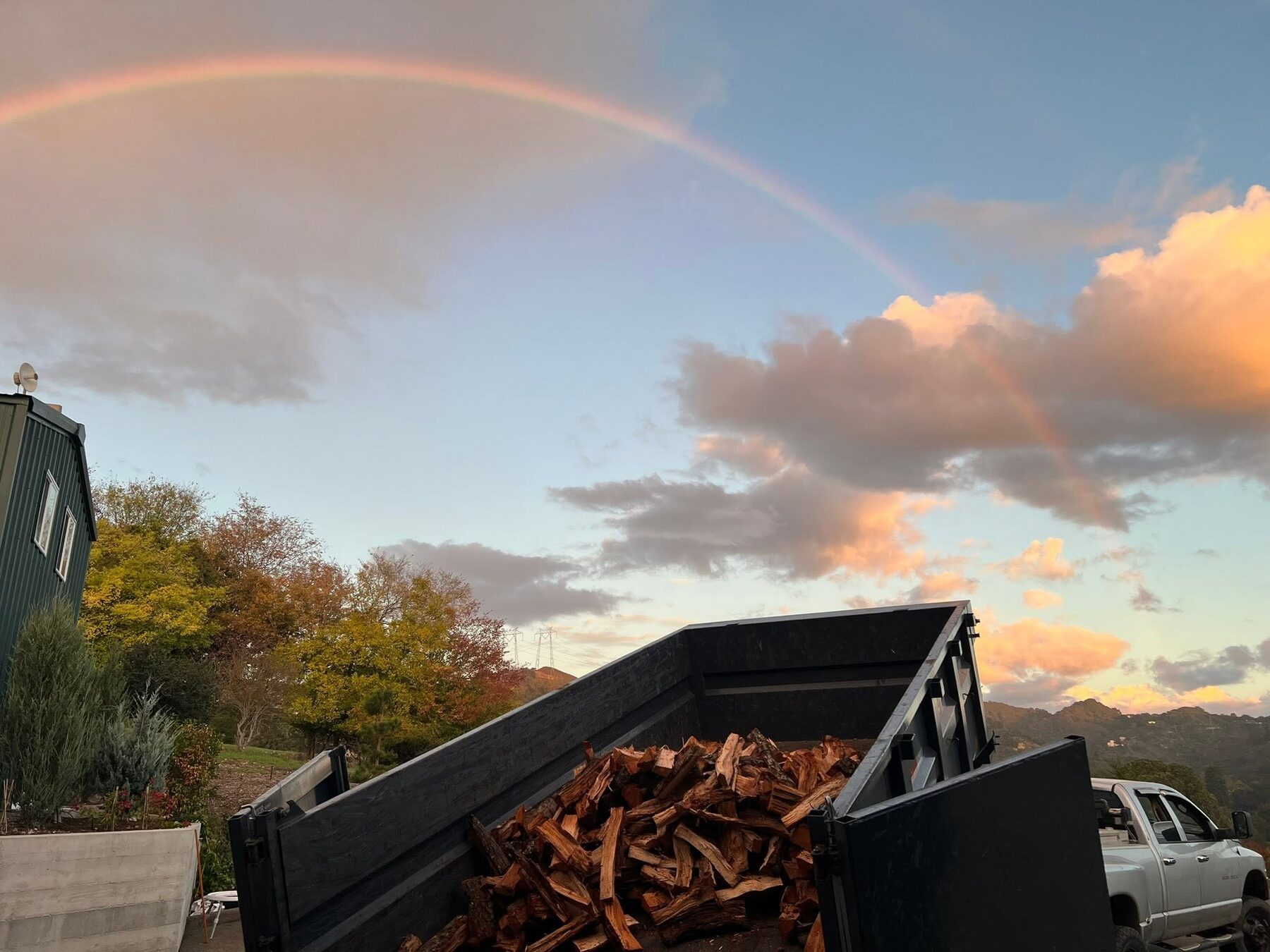 A load of split oak in the 805 Red Oak dump truck at sunset